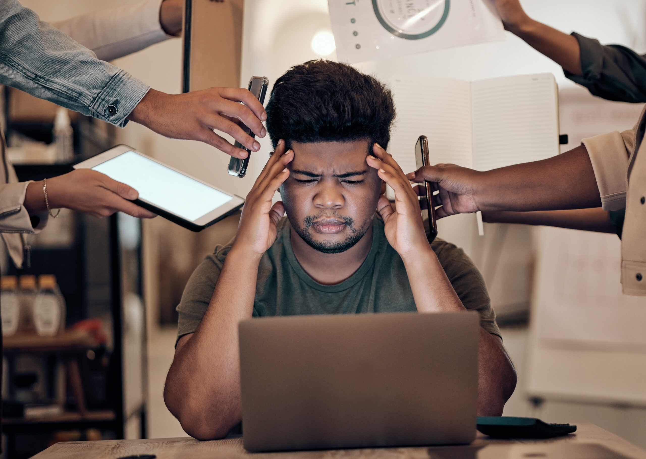 Businessman, stress and headache on laptop multitasking, team management or chaos in modern office.